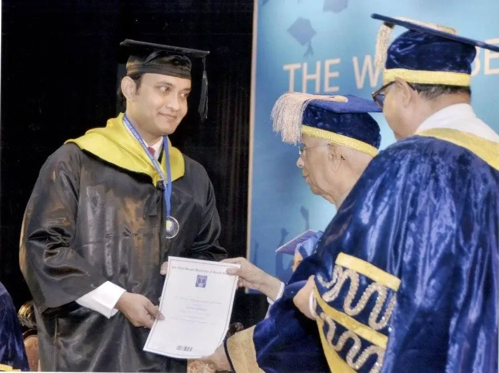 Receiving Gold Medal from Governor
